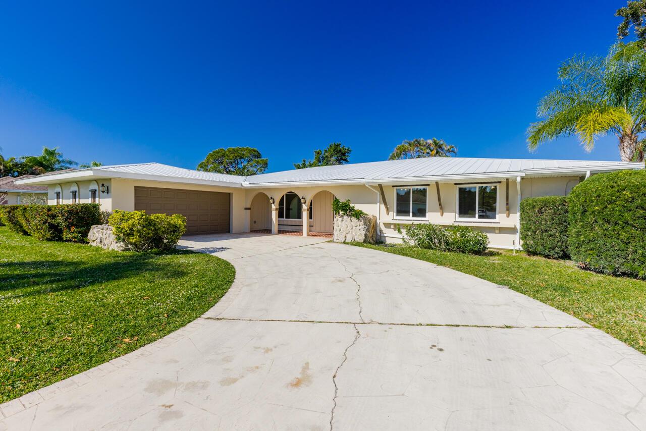 Completely remodeled 4 bedroom 2 bath pool home located in the desirable neighborhood of Sandpiper in Port St Lucie. Metal roof, massive screened patio, paver deck and inground salt chlorinated pool overlooking The Saints golf course and pond. Interior offers luxury vinyl flooring, spacious living areas, formal dining room with built in coffee/wine bar. Modern kitchen with brand new appliances and quartz countertops opens up to the living room.