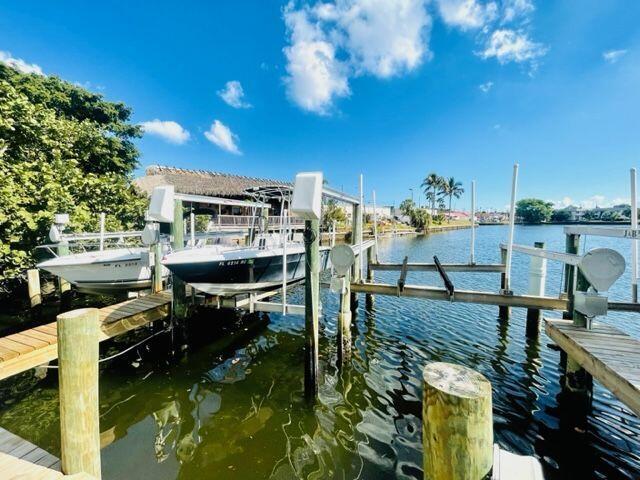 RARE FIND !!!STUNNING TOWNHOME WITH PRIVATE BOAT DOCK. COME AND ENJOY PEACE & TRANQUILTY AT THIS BEAUTIFUL UPDATED HOME FEATURING 3 LARGE BEDROOMS, 2.5 BATHROOMS, HIGH CEILINGS, COVERED PATIO WITH VIEWS OF POOL, PRIVATE BOAT DOCK (UP TO 25FT BOAT) AND WATER WAY LEADING OUT TO THE ATLANTIC OCEAN. LOCATED MINS TO THE BEACH, SHOPPING & ALL YOUR DINING NEEDS. DON'T LET THIS RARE GEM PASS YOU BY. ALL SIZES APPROX. NOT GUARANTEED. FYI: NEW EXTERIOR SIDING, EXTERIOR PAINT, NEW BOAT DOCKS & BATHROOMS WERE REDONE IN 2022.