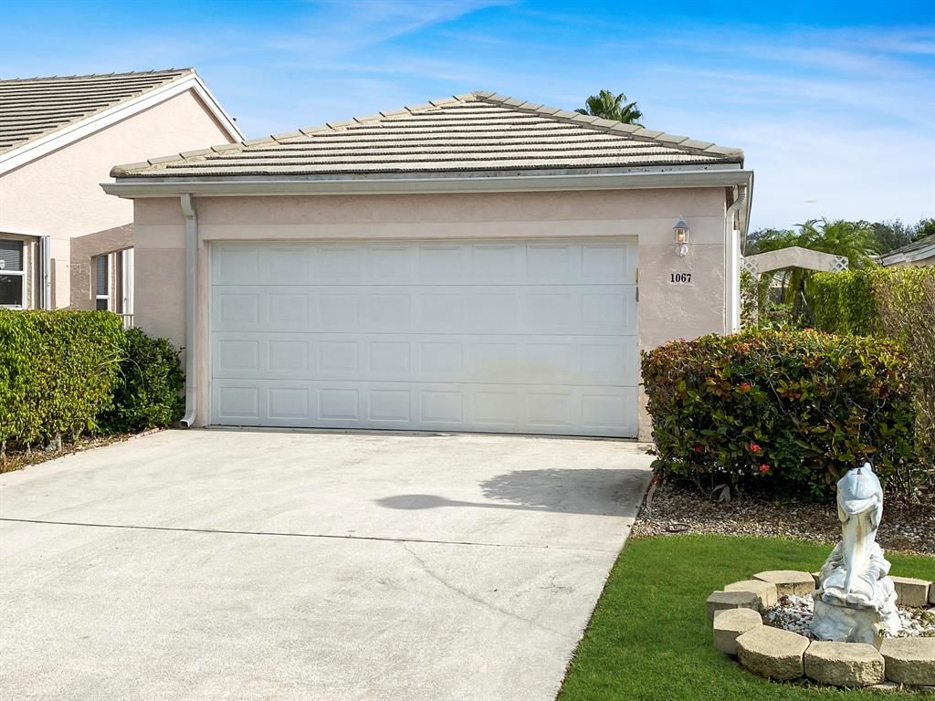 Photo of 1067 Island Manor Drive Dr, Green Acres, FL 33413 (MLS # R10772709)