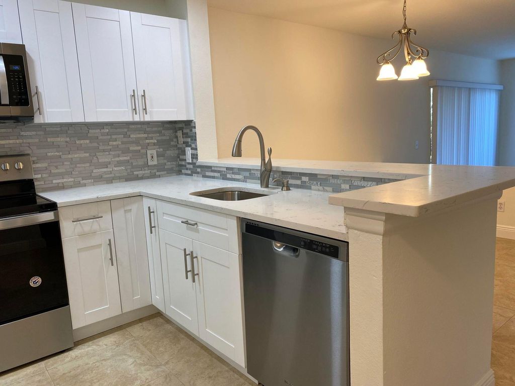 Photo of 1885 Palm Cove Boulevard #10-205, Delray Beach, FL 33445 (MLS # B26013813)