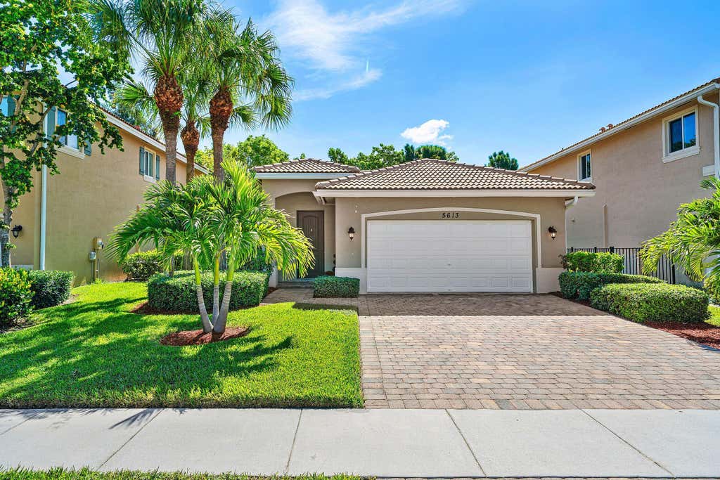 Photo of 5613 Caranday Palm Drive, Greenacres, FL 33463 (MLS # B26064001)