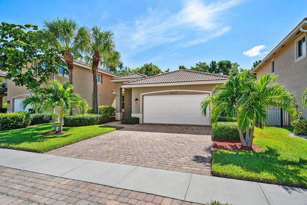 Photo of 5613 Caranday Palm Drive, Greenacres, FL 33463 (MLS # B26064001)