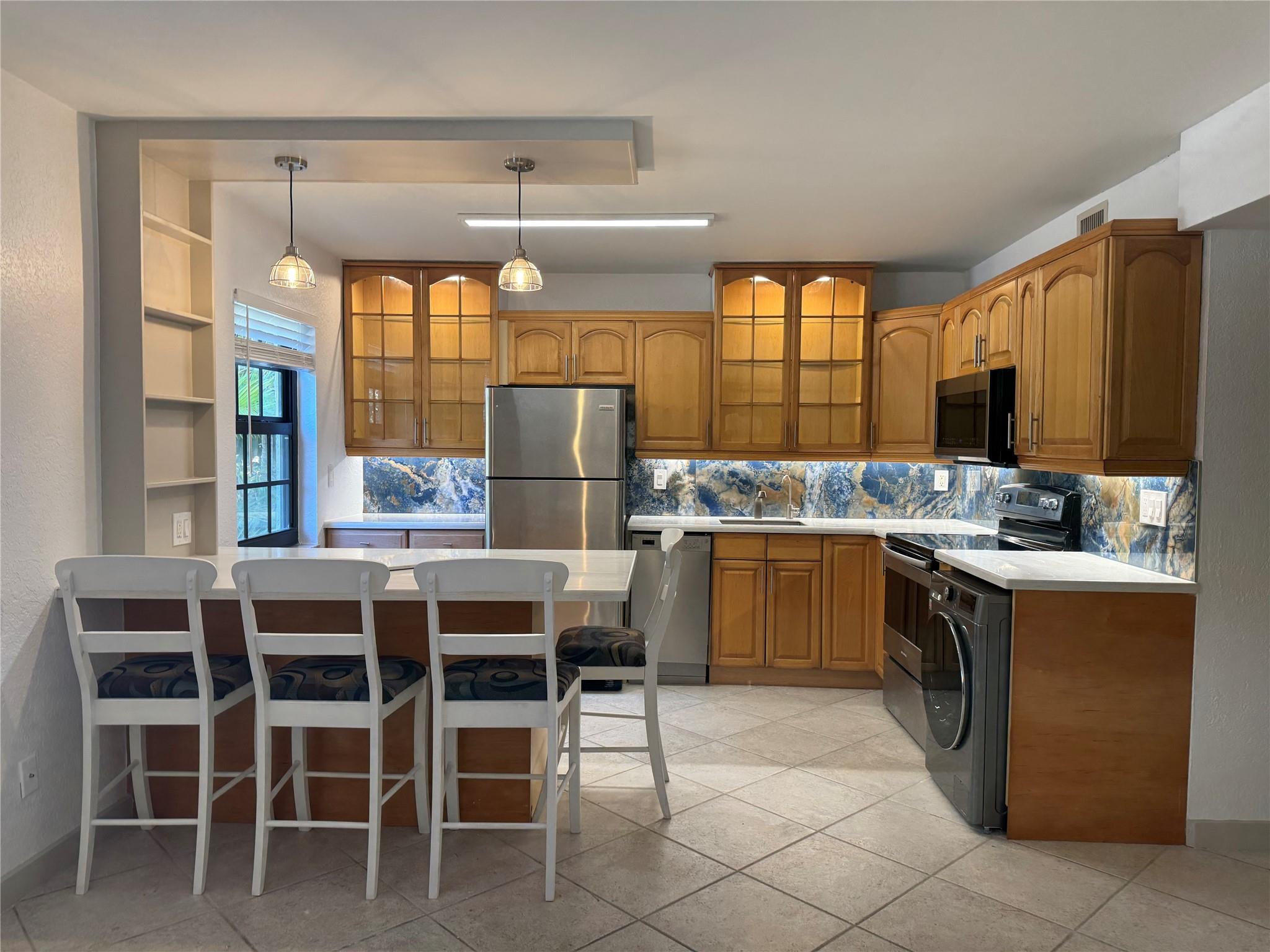 A Must See! Gorgeously Remodeled Kitchen with Exquisite Backsplash, Washer/Dryer in Apartment, Wine Cooler, Open concept great for entertaining in this freshly painted light and bright living space. Tastefully Remodeled Bathroom, Oversized Primary Bedroom, Impact Windows Throughout, Instant Hot Water Heater, Corner Unit Situated in a Boutique Building Next to a Community Preserve & Dog Park, So Close You Can Walk to the Drive.
Pets Welcome!
FYI-Condo 40 year inspection completed & passed in the last 2 years.
This home is also available for Lease Purchase. Please contact agent for details.