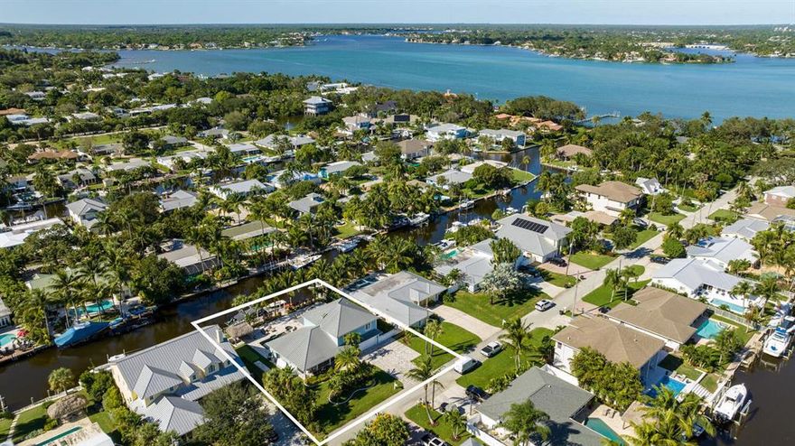 Experience Florida living at its best in this beautiful waterfront home just minutes from Jupiter Sand Bar and Jupiter Inlet. This coastal home features superior finishes and materials. You will enjoy water and dock views from the pool, expansive marble deck, tiki area, fire pit area and lanai. Total Sq. Ft. 4,058, Living Sq. Ft. 3,178,  Lot measures 100 x 123,  4 bedroom, office/den, 3 bath, 2 car garage, pool/spa, dock. 100' of Water frontage on wide canal, 60' Dock with electric and water, Propane gas Impact windows and doors , Heated salt system pool with marble paver decking, CBS Construction, Metal Roof, Electric fireplace, Thermadore kitchen appliances marble counter tops with full tile glass backspash, Double wall oven, Center island with counter cooktop, pantry, 1st