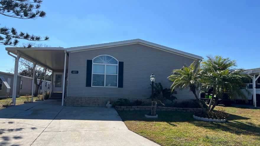 As-is 2-bedroom, 2.5-bath manufactured home in Barefoot Bay with land ownership (no lot rent). Tile flooring in main living areas, with carpet in bedrooms and library. Large enclosed porch with tile flooring. Indoor washer and dryer. Attached storage room.

The home is being sold fully furnished; all contents currently in the home convey.

Updates include a new roof installed in 2025 and an AC system approximately 2 years old. A 4-point inspection was completed on 08/23/2025.

Barefoot Bay Recreation District (BBRD) fees: $1,000 annual amenity fee paid with property taxes and a one-time $1,605 fee due at closing, payable to BBRD.

Rental restrictions apply: 3-month minimum rental. Airbnb is not permitted. 
Maximum of two (2) pets allowed.