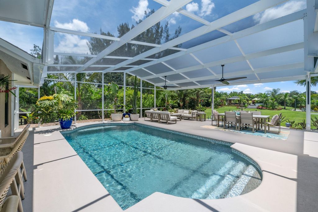 Photo of 14800 April Drive, Loxahatchee Groves, FL 33470 (MLS # B26049603)