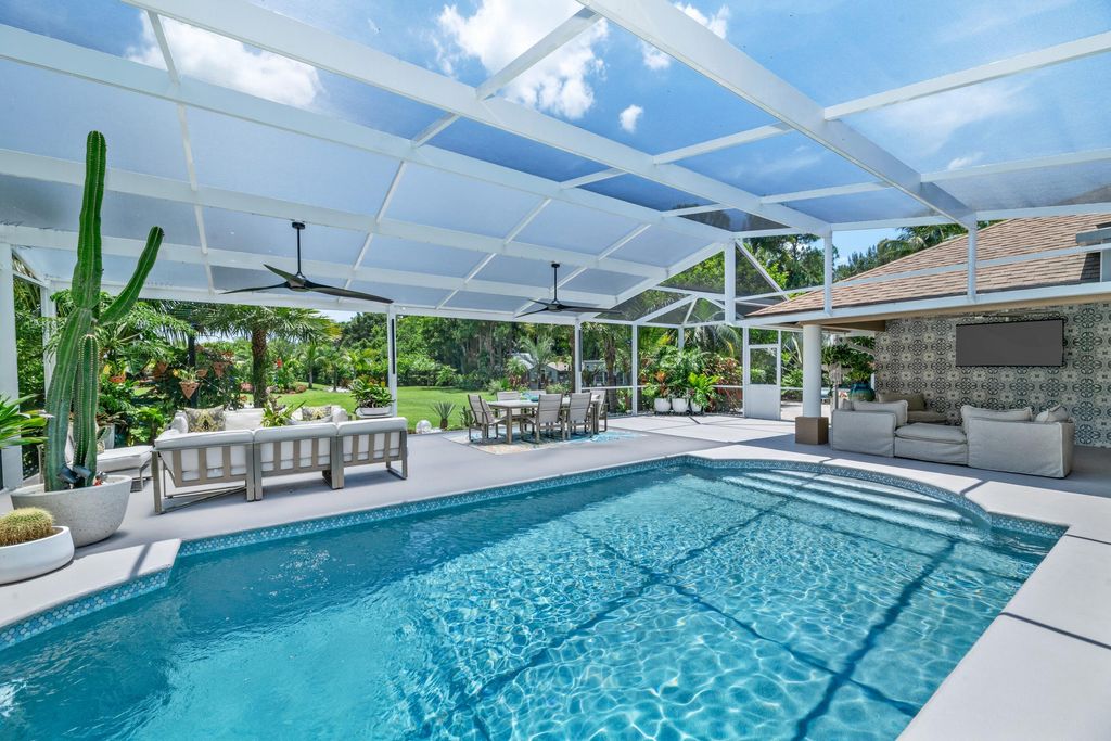 Photo of 14800 April Drive, Loxahatchee Groves, FL 33470 (MLS # B26049603)