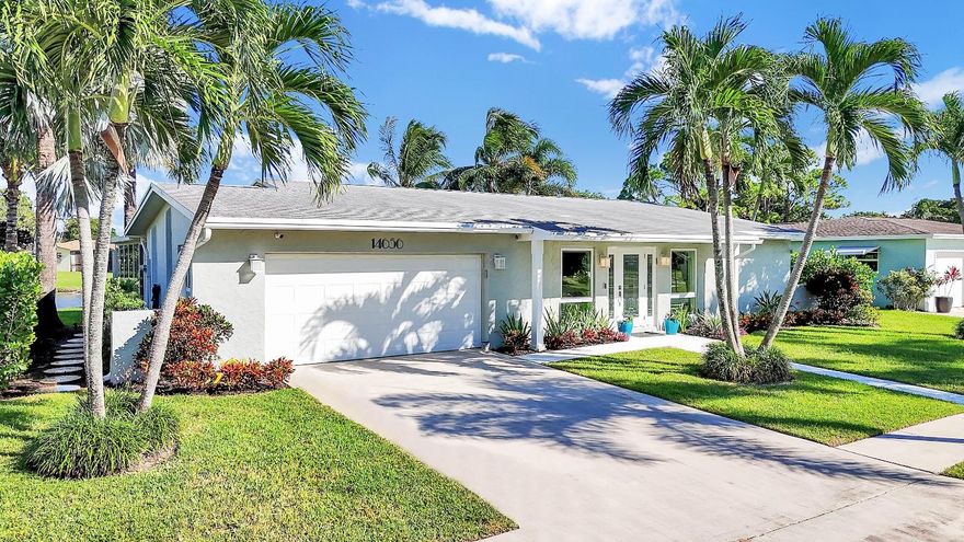 Experience lakeside living at its finest in this beautifully updated 2B/2BA waterfront home with a 2-car garage in Coco Wood Lakes- one of Delray Beach's most convenient, active-adult & pet-friendly communities near Atlantic Ave & the beach. This light-filled home offers open living areas flowing to a lanai & outdoor patio- perfect for relaxing or entertaining with tranquil lake views. A new glass-enclosed sunroom with split A/C adds versatile space for an office, studio, or gym. Modern kitchen features stainless appliances, dual barn-door pantries & a large island. Savoia Italia porcelain tile throughout, new impact windows/sliders, fresh interior/exterior paint, custom closets, updated baths, new W/D, Vivint security & landscape lighting. Low HOA includes cable, internet & amenities. This fully renovated 2-bedroom, 2-bath single-family home with an attached two-car garage combines comfort, style, and modern efficiency with expansive water views and refined upgrades throughout.

Interior Highlights
-Open-concept floor plan with Savoia Italia porcelain tile throughout
-Modern chef's kitchen with stainless-steel appliances, double sinks, deep drawers, two large pantries with barn doors, and a spacious island perfect for casual dining or hosting guests
-Backyard lanai with tranquil lake views in a park-like setting, plus an outdoor lakeside patio perfect for relaxing or entertaining
-New double-pane glass sunroom with custom motorized blackout shades and a split A/C-heat unit, offering scenic lake views. Ideal for a home office, studio, or fitness space
-New impact-glass windows and sliding doors with custom window treatments throughout including smart shades and roller shades 
-Custom closet systems in both bedrooms
-Primary suite with walk-in closet and ensuite bath featuring a new frameless shower door and new split A/C and heat unit
-Guest bedroom with its own full bath and privacy via a split-bedroom layout
-Indoor laundry room with new washer and dryer
-Freshly painted interior and exterior in a clean, modern color palette

Exterior & Systems
-Impact-glass hurricane protection throughout
-New Vivint security system- 3 outside cameras, 2 water sensors, remote controlled thermostat, remote garage and front door, and smoke and CO2 detectors
-Landscape lighting and upgraded sprinkler system (lake-drawn irrigation)

Community & Location
Coco Wood Lakes is a pet-friendly 55+ community of single-family homes with no mandatory memberships and low HOA fees ($204/month) covering cable, internet, amenities, common areas, property management, trash, sewer, and reserve funds.
Residents enjoy a clubhouse with a fitness center, theater, billiards and card rooms, and an outdoor pool and spa (spa replaced spring 2025). Rentals are permitted immediately, up to twice per year, with a 90-day minimum.
Ideally located just five miles from the ocean and downtown Atlantic Avenue, with convenient access to dining, shopping, and medical services.
