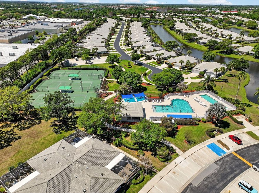 THE LAKES AT ST. LUCIE WEST! Beautifully appointed 2-bedroom, 2-bath patio home featuring an expansive, fully screened outdoor living area—ideal for alfresco dining, entertaining, or quiet relaxation year-round. This light-infused residence showcases an open-concept layout with soaring vaulted ceilings and a desirable split-bedroom design, with each suite offering direct access to the spacious patio. Tile flooring flows throughout, complemented by stainless steel appliances, a full-size washer and dryer, and accordion hurricane shutters. The comprehensive maintenance fee encompasses lawn care, basic cable, exterior and roof upkeep, building insurance, on-site management, and more. Residents enjoy the community amenities offering a pool, tennis courts, pickleball, sidewalks, & streetlights