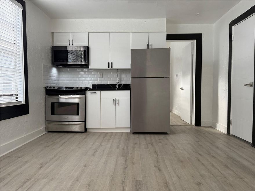 Come see this charming, fully renovated 1-bedroom, 1-bath apartment in a prime location just blocks from Downtown Hollywood! Featuring modern finishes throughout, this unit boasts stainless steel appliances, including a sleek electric stove, refrigerator, and microwave in the kitchen. Kitchen cabinets and bathroom cabinets come with soft closing hardware. The open living space has beautiful natural light from large windows with blinds. The bathroom is updated with a stylish tiled shower and contemporary fixtures. Enjoy new flooring throughout the living room and bedroom. There is washer and dryer on premises. This unit won’t last long—schedule your viewing today!