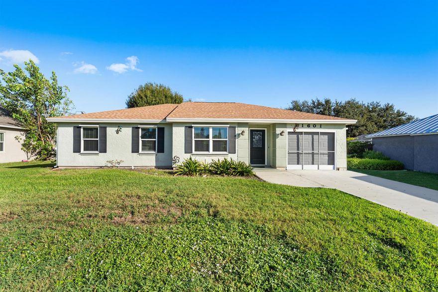 Fall in love with this bright, airy, move-in ready home! The open layout boasts soaring ceilings and abundant natural light. Major upgrades - new roof, impact windows/doors, and water heater - offer lasting peace of mind. The updated kitchen features new cabinets, quartz countertops, and a raised breakfast bar that flows into spacious living areas with recessed lighting and 16'' tile floors. Three well-sized bedrooms (one ensuite) include wood laminate floors and large closets. A second bath adds a new vanity, toilet, and tub. Enjoy a fenced patio and large backyard - perfect for relaxing or adding a pool. The screened garage adds flexible living space. Ideally located near I-95, the Turnpike, shopping, dining, Tradition, St. Lucie West, and Cleveland Clinic Hospital. A true turnkey gem!