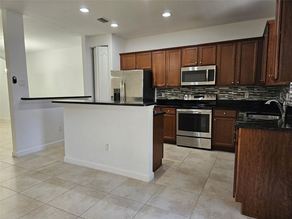 Photo of 9627 Watercrest Isle, Parkland, FL 33076 (MLS # F10504010)