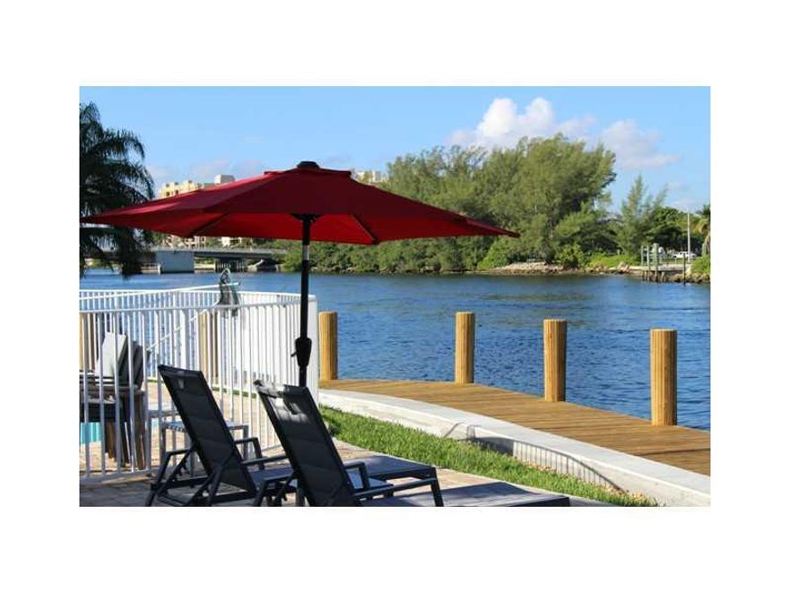 Fully remodeled, Boaters Paradise! Waterfront community on the Intracostal perfect for vacation home or all year round. Fully upgraded and practically new including porcelain tile, quartz countertops and much more!. Perfect purchase for prmary residents,  second home owners and investors. Just 2 1/2 block from the beach access. Common areas include heated pool, sun deck, outdoor couches, tables, lounge chairs and umbrellas!