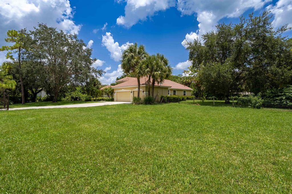 Photo of 7950 Hall Boulevard, The Acreage, FL 33470 (MLS # R10901067)