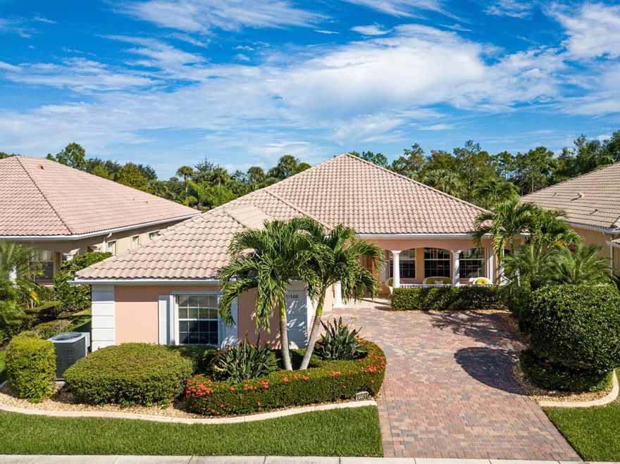 Tastefully appointed, quality built Di Vosta Carlyle floor plan with 4 bdr/3.5 baths, screen enclosed heated pool with private lake views on one of the communities premium lots. Kitchen boasts newer cabinet fronts & additional built ins with desk, wine cooler & storage, stainless steel appliances, newer  hardware. Other upgrades include living room fireplace, crown molding thru out, wood floors in living room, tile & wood look floors thru out the remainder of the home, no carpets! Accordion shutters for all windows/sliders, pool heater, full home water filtration, tankless hot water heater, AC 2017, outside landscape curbing, ring doorbell & exterior cameras. Newly remodeled clubhouse &  full amenities, 24 hr manned gated security, walk to Tradition shops, restaurants & event