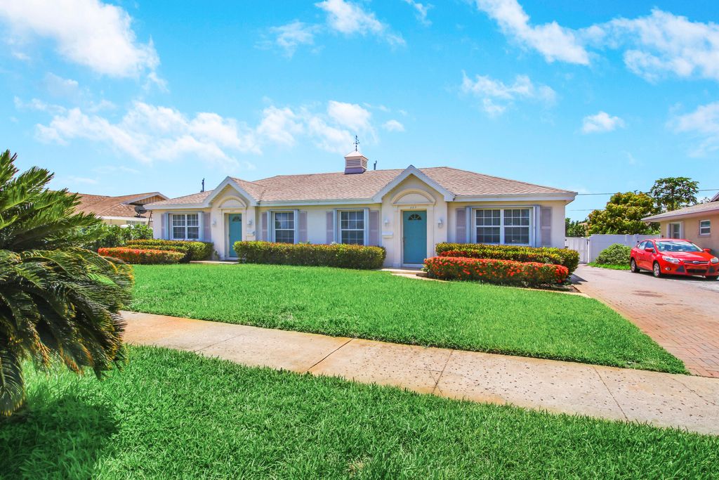 Photo of 527 W Jasmine Drive, Lake Park, FL 33403 (MLS # B26008651)
