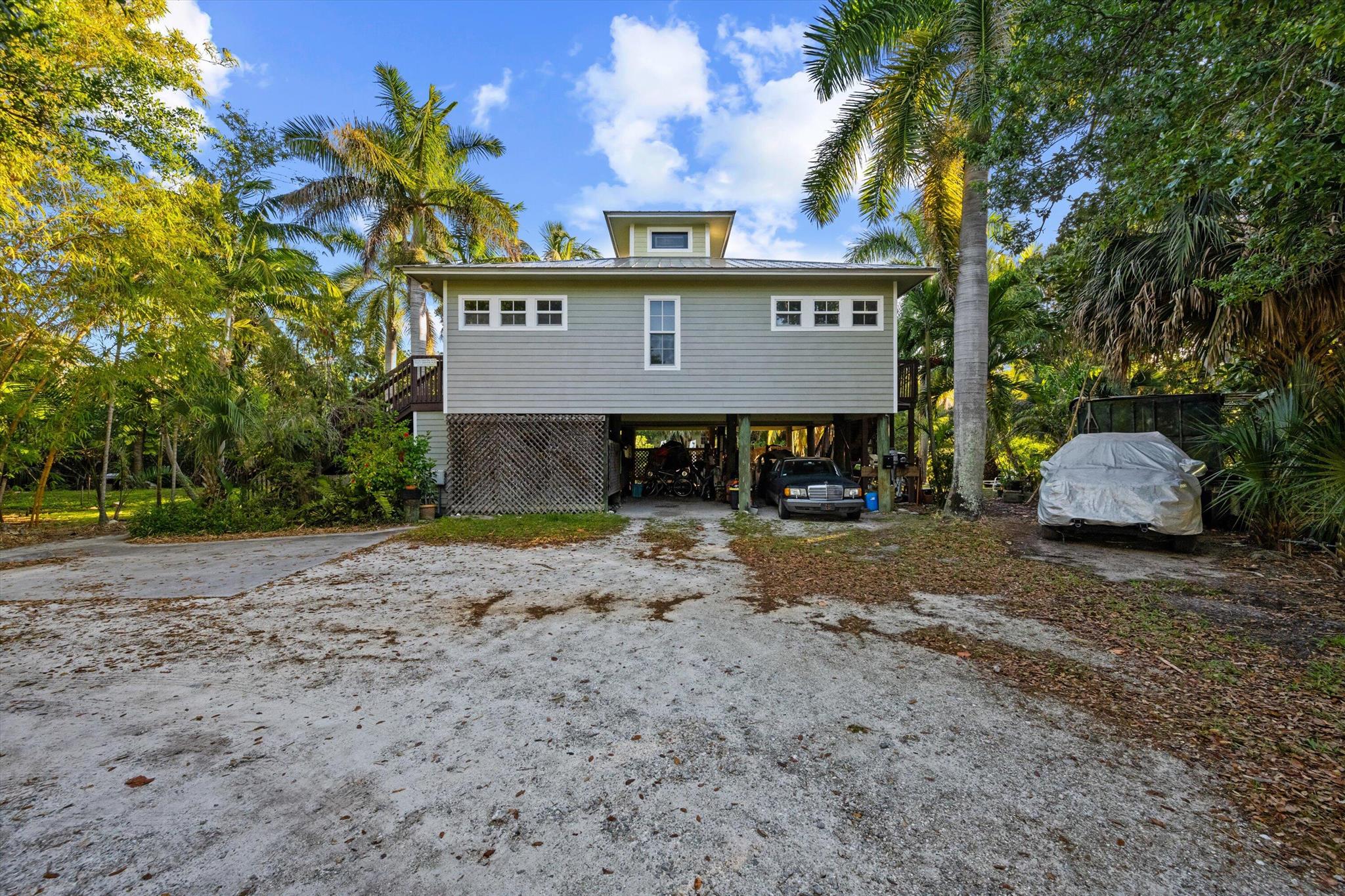 Discover 201 SW 6th St in ''Historic Downtown Stuart''. Situated in the heart of the Stuart ''CRA'' (Community Redevelopment Agency). With 206 linear feet of waterfront + ocean access and Zoned B-2 with so many allowed permitted possibilities...yoga studio, family daycare, business & residence in same building, hotel/motel, adult/child care center, religious institution, massage therapy, medical office, bed & breakfast, vacation by owner, boat sales & service, health spa, microbrewery, veterinarian, medical marijuana dispensary, and so much more. Property has a Key West feel with mature Florida foliage. There is an elevated Key West style property.
