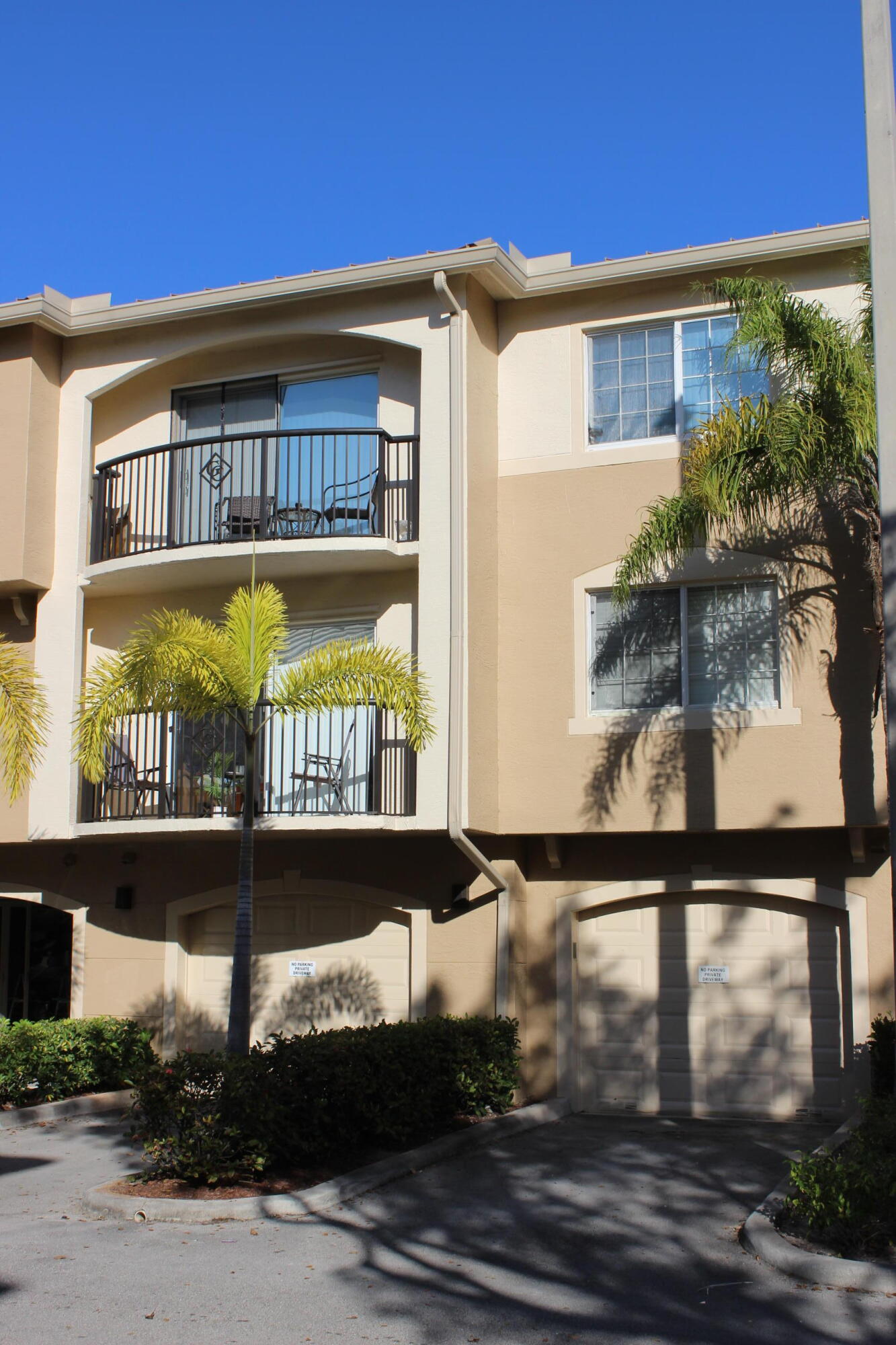 Stunning 2BD/2BA condo with garage located in the gated community of Royal Palm Beach. This move-in ready home features a spacious kitchen with granite countertops, rich wood cabinetry, and crown molding. Ceramic tile throughout and freshly painted in neutral tones. Enjoy peaceful garden and pool views from your private patio. Professionally cleaned and ready for your personal touch. Community offers resort-style amenities including a swimming pool, tennis courts, fitness center, walking trails, and beautifully maintained landscaping. Strong HOA with solid reserves and no open special assessments. This is the lowest priced 2/2 with garage in the community--an incredible value in a prime location. Don't miss out!