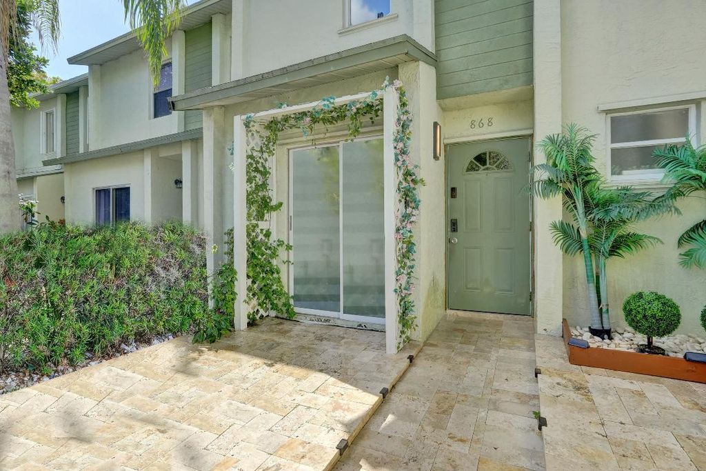 Photo of 868 Crystal Lake Drive, Deerfield Beach, FL 33064 (MLS # R11153676)