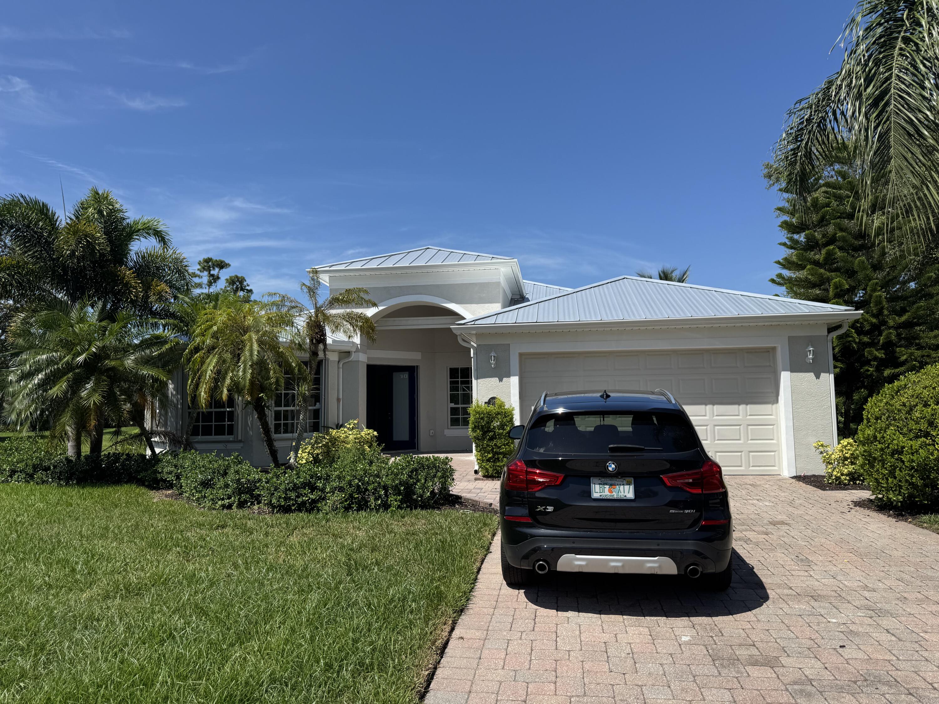COMPLETELY REMODELED 4 BEDROOMS AND 2 AND 1/2 BATHROOMS. BRAND NEW UPSCALE SOFT TOUCH KITCHEN CABINETS WITH QUARTZ COUNTER TOPS AND TILED BACKSPLASH. ELEGANT REDONE BATHROOMS TILED TO THE CEILING WITH HIGH END FRAMELESS GLASS SHOWER DOORS AND RAINFALL SHOWER. 33'' PORCELAIN TILE THROUGHOUT. LARGE WALK IN CLOSETS. STAINLESS STEEL APPLIANCES. NEWER METAL ROOF. BRAND NEW A/C, WATER HEATER AND UPGRADED ELECTRIC. LARGE INGROUND POOL WITH SCREENED PATIO. LAKE VIEW. LOCATED IN A CUL DE SAC LOT.