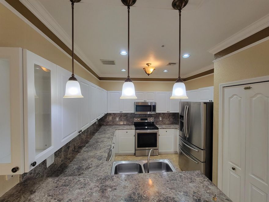 Truly one of the kind, designer's delight spacious 3 bedroom 2.1 bathroom condo with a feel of a townhome ( two story). Corner unit in gated development with all ''A'' rated school district is a rare find. Exceptional location with a walking distance to Publix shopping plaza, right across the street from all kinds of shopping, parks & recreational facilities, restaurants, 2 miles to Wellington Regional Hospital & Mall, easy access to FL Turnpike, 15 min to Equestrian fields & about the same to PB Int'l Airport. Among some of the Interior features are custom made wall decorations & crown moldings, tasteful paint, newer upgraded kitchen & bathroom cabinets, countertops, stainless steel appliances, upgraded tiled floors downstairs. Full size brand new WD, water,sewer & trash included in rent