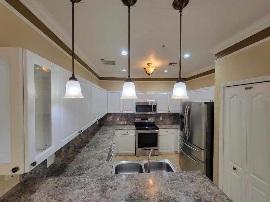 Truly one of the kind, designer's delight spacious 3 bedroom 2.1 bathroom condo with a feel of a townhome ( two story). Corner unit in gated development with all ''A'' rated school district is a rare find. Exceptional location with a walking distance to Publix shopping plaza, right across the street from all kinds of shopping, parks & recreational facilities, restaurants, 2 miles to Wellington Regional Hospital & Mall, easy access to FL Turnpike, 15 min to Equestrian fields & about the same to PB Int'l Airport. Among some of the Interior features are custom made wall decorations & crown moldings, tasteful paint, newer upgraded kitchen & bathroom cabinets, countertops, stainless steel appliances, upgraded tiled floors downstairs. Full size brand new WD, water,sewer & trash included in rent