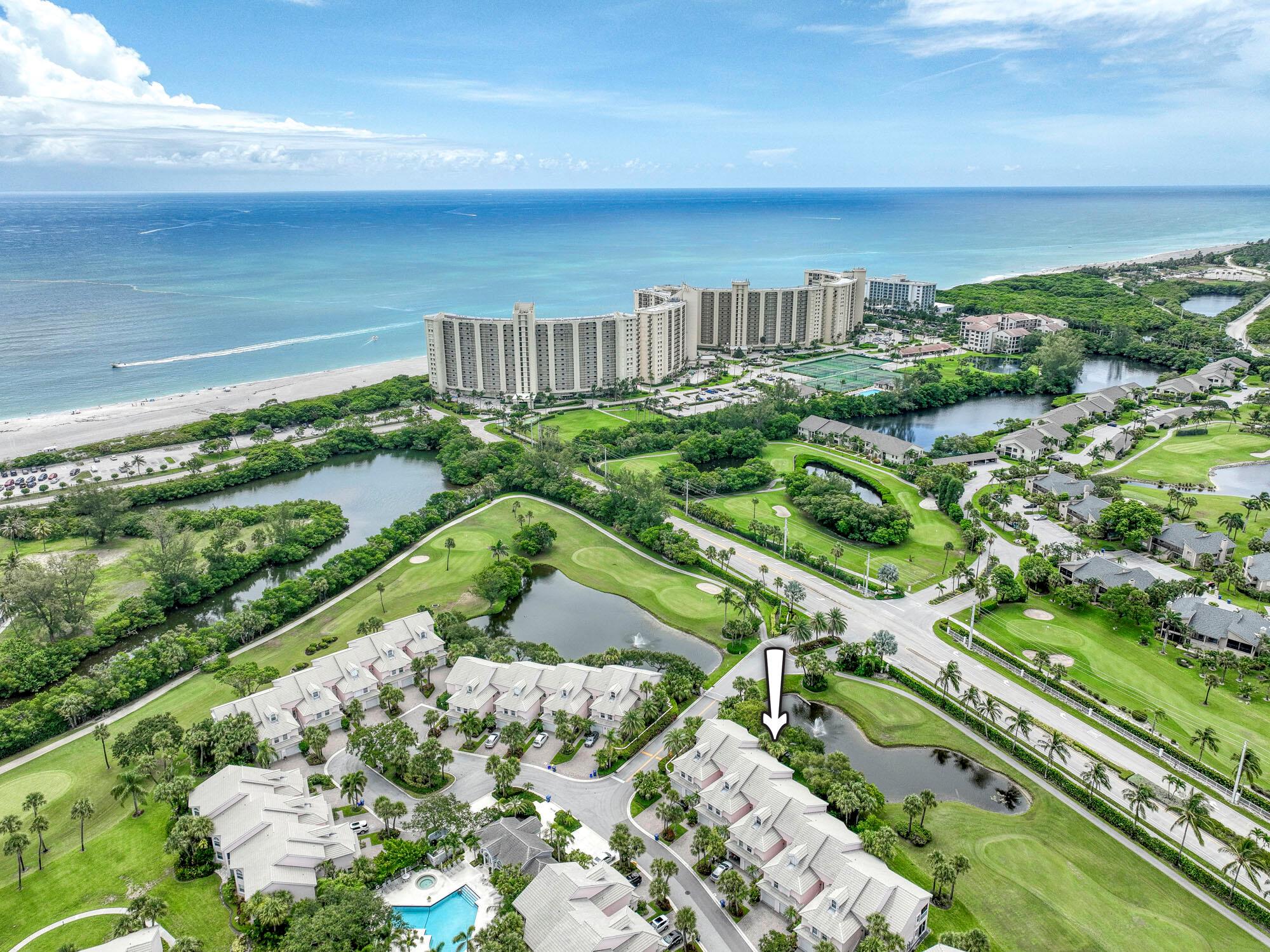 Available Off-Season($4000/month) Steps from turquoise Jupiter Beach lies this stunning 2-level condo! Golf & lake views grace your southern lanai, where ocean breezes & sunset hues mingle. Inside, a sleek kitchen boasts Corian, white Shaker cabinets, & stainless steel. Tile flows underfoot, extending seamlessly to the expanded lanai for ultimate indoor-outdoor living. Completely renovated second floor bedroom, bathroom and staircase. Upstairs, find 1 tranquil bedroom & a spa-like master bath. 1-car garage, W/D, & pool access complete this Inlet District dream! Walk to beach, shops, & restaurants.