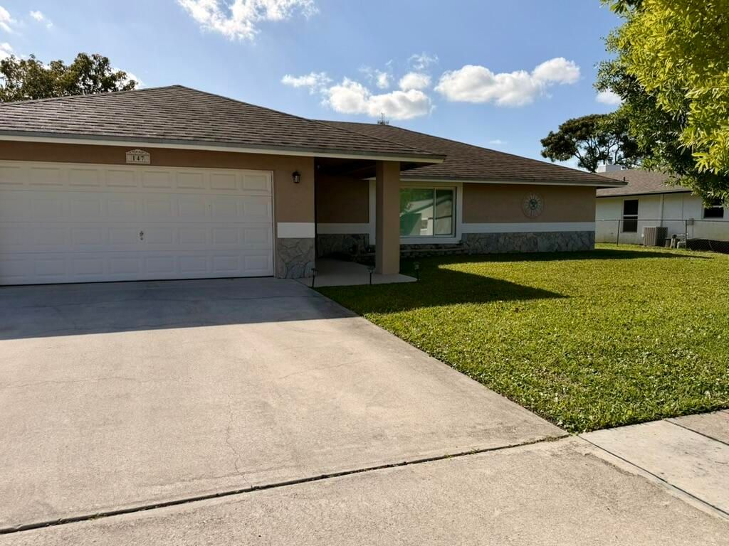 Photo of 147 Sunflower Circle, Royal Palm Beach, FL 33411 (MLS # B26040535)