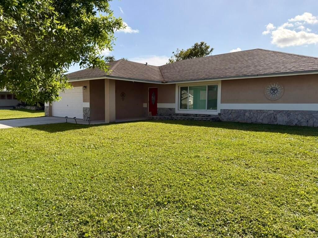 Photo of 147 Sunflower Circle, Royal Palm Beach, FL 33411 (MLS # B26040535)