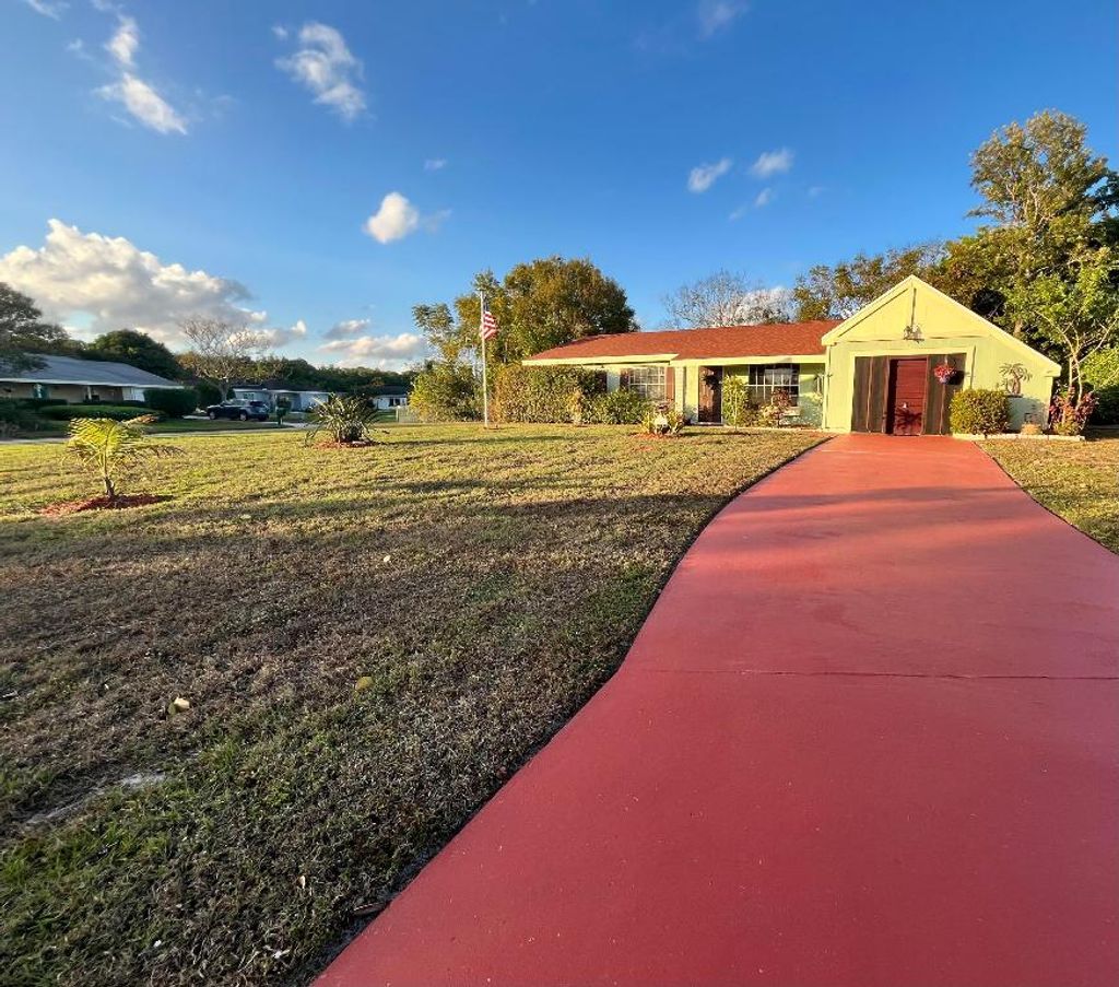 Photo of 749 SW Watson Place, Port Saint Lucie, FL 34953 (MLS # R11157613)