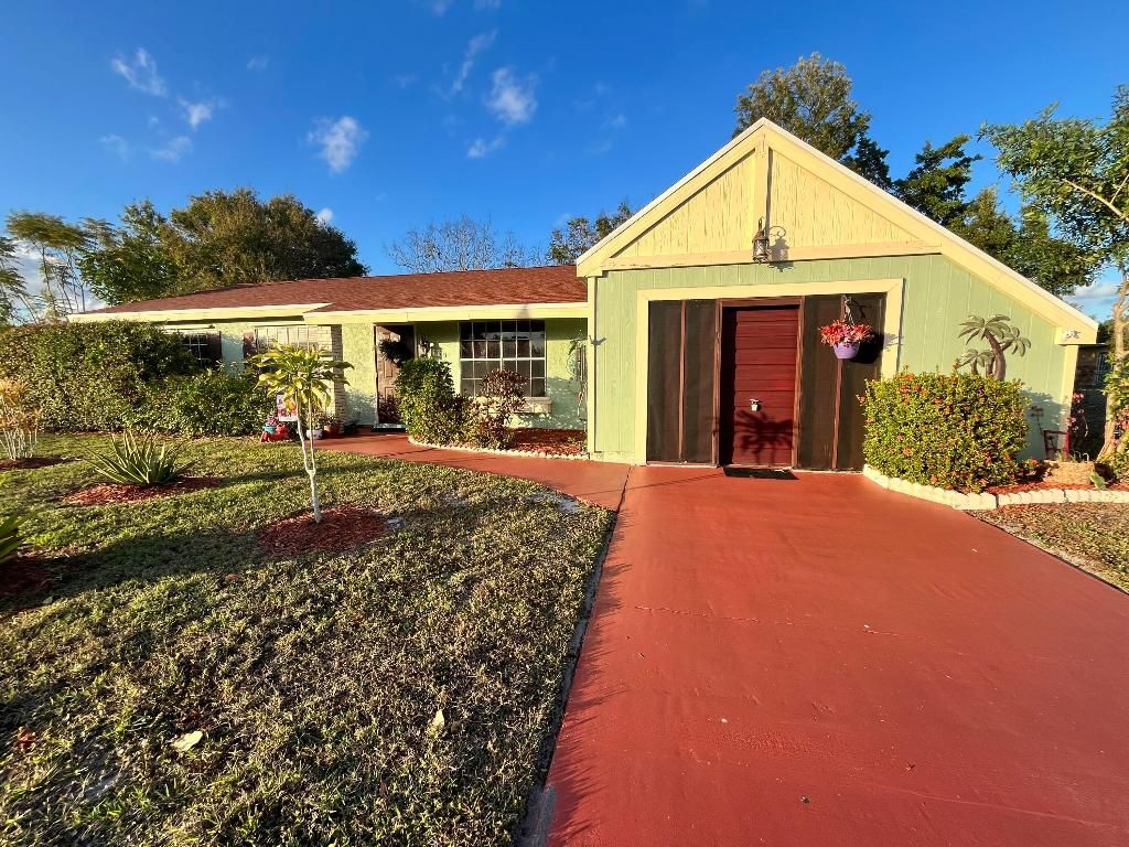 Photo of 749 SW Watson Place, Port Saint Lucie, FL 34953 (MLS # R11157613)