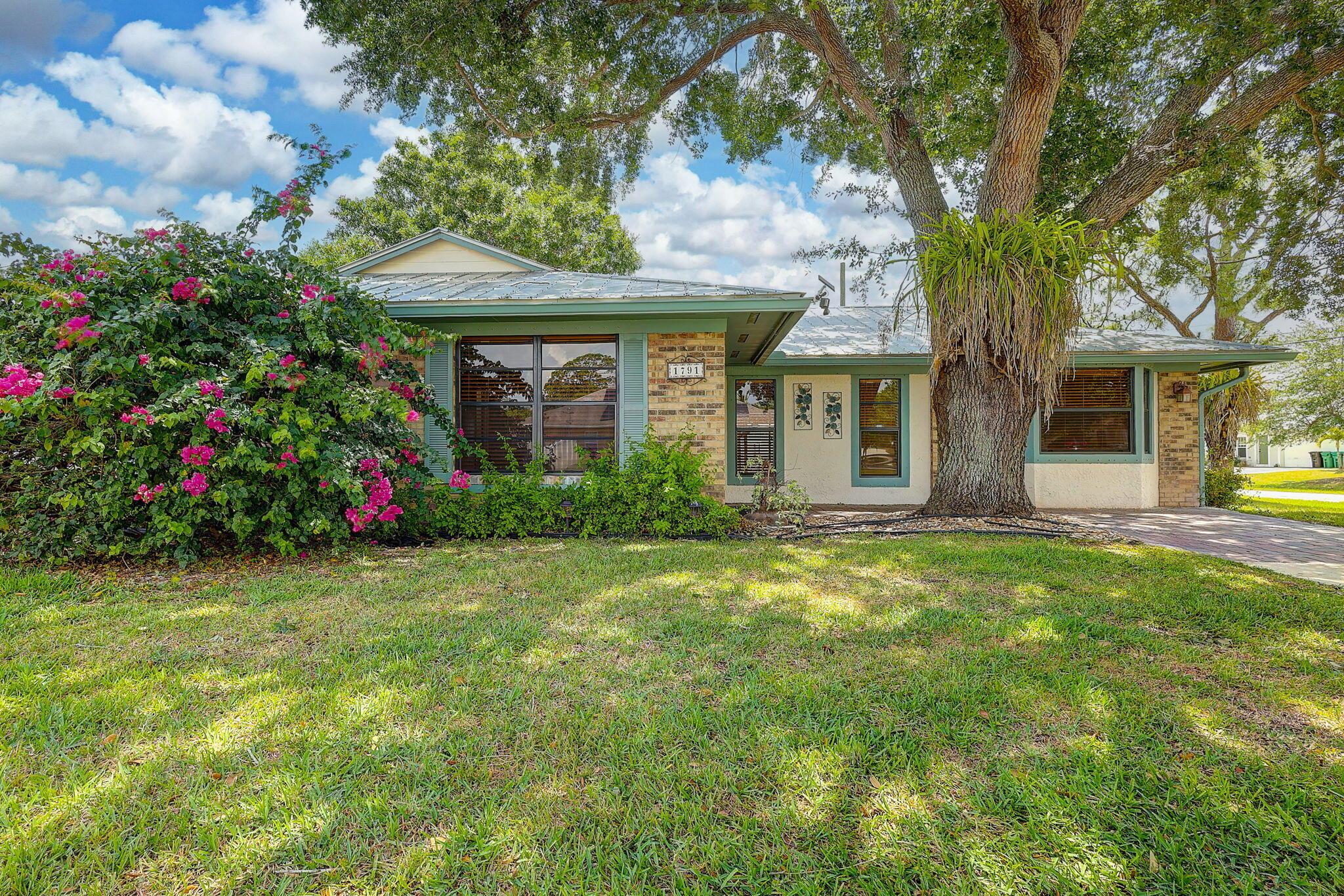 Step into this quaint & rustic 3 bed/2 bath home that blends charm with modern comfort. The renovated designer kitchen features stainless steel appliances, pull out spice cabinet & pantry with pull out shelves. Relax with a good book in the cozy reading kitchen window nook or step outside and unwind under the pergola adorned with soft evening lights & a fire pit, perfect for evening gatherings under the stars. 2024 - AC & Water Heater. 2025 New carpet in bedrooms. 2025 - New window screens Fully wired shed with refrigerator. Metal roof. Side fence entrance for boat or truck. Space for a pool.