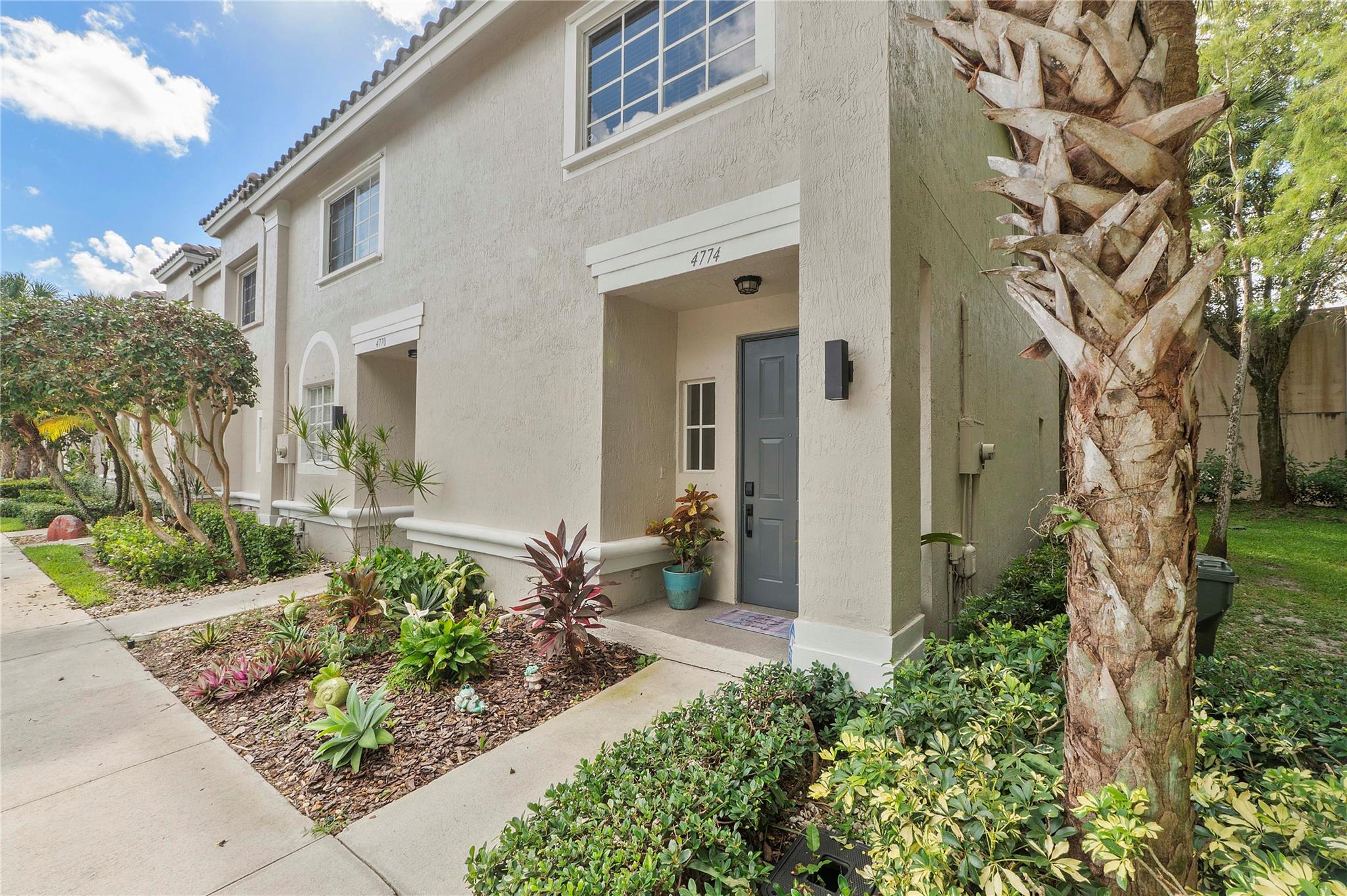 Bright and Spacious corner townhome with extra windows for natural light! This 3 bedroom, 2.5 bathroom gem in the gated community of Victoria Isles features a new roof, new custom kitchen with quartz countertops, new smudge-free stainless appliances, bar counter seating & built-in wine cooler, new water heater, new water resistant laminate flooring upstairs, marble downstairs, new washer & dryer, new lighting & ceiling fans, newer AC, recently updated master shower and more! Open living area looks out to the back patio and overlooks a nature preserve. No rear neighbors. 2 parking spaces at front door! Bonus exterior storage room. 100% storm shutters. Low HOA Fee covers gate & app, security, alarm, exterior & paint, landscaping, pool, clubhouse. Close to Promenade, highways and more!