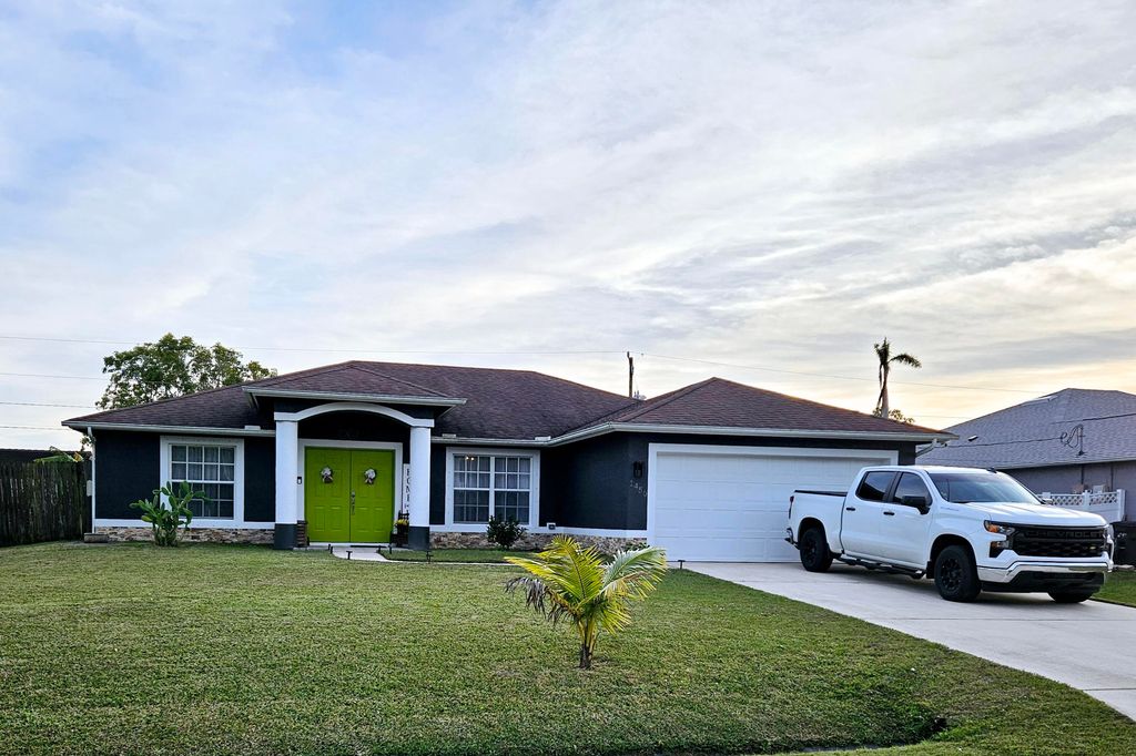 Photo of 1450 SW Dow Lane, Port Saint Lucie, FL 34953 (MLS # R11057194)