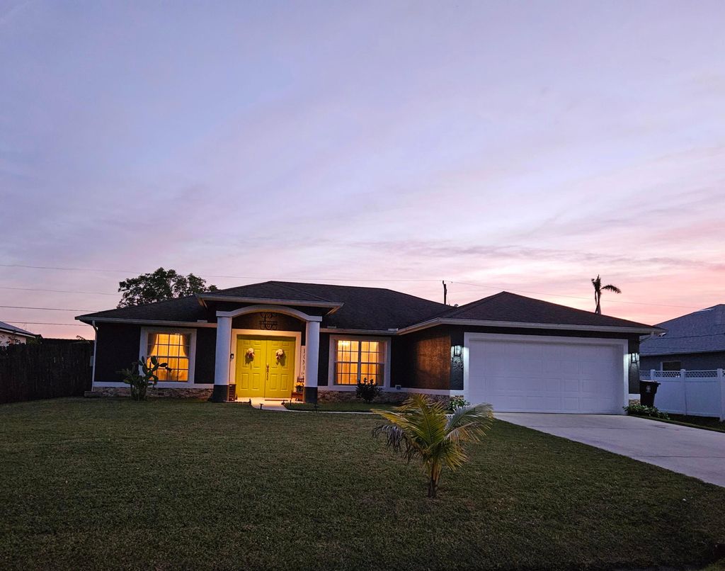 Photo of 1450 SW Dow Lane, Port Saint Lucie, FL 34953 (MLS # R11057194)