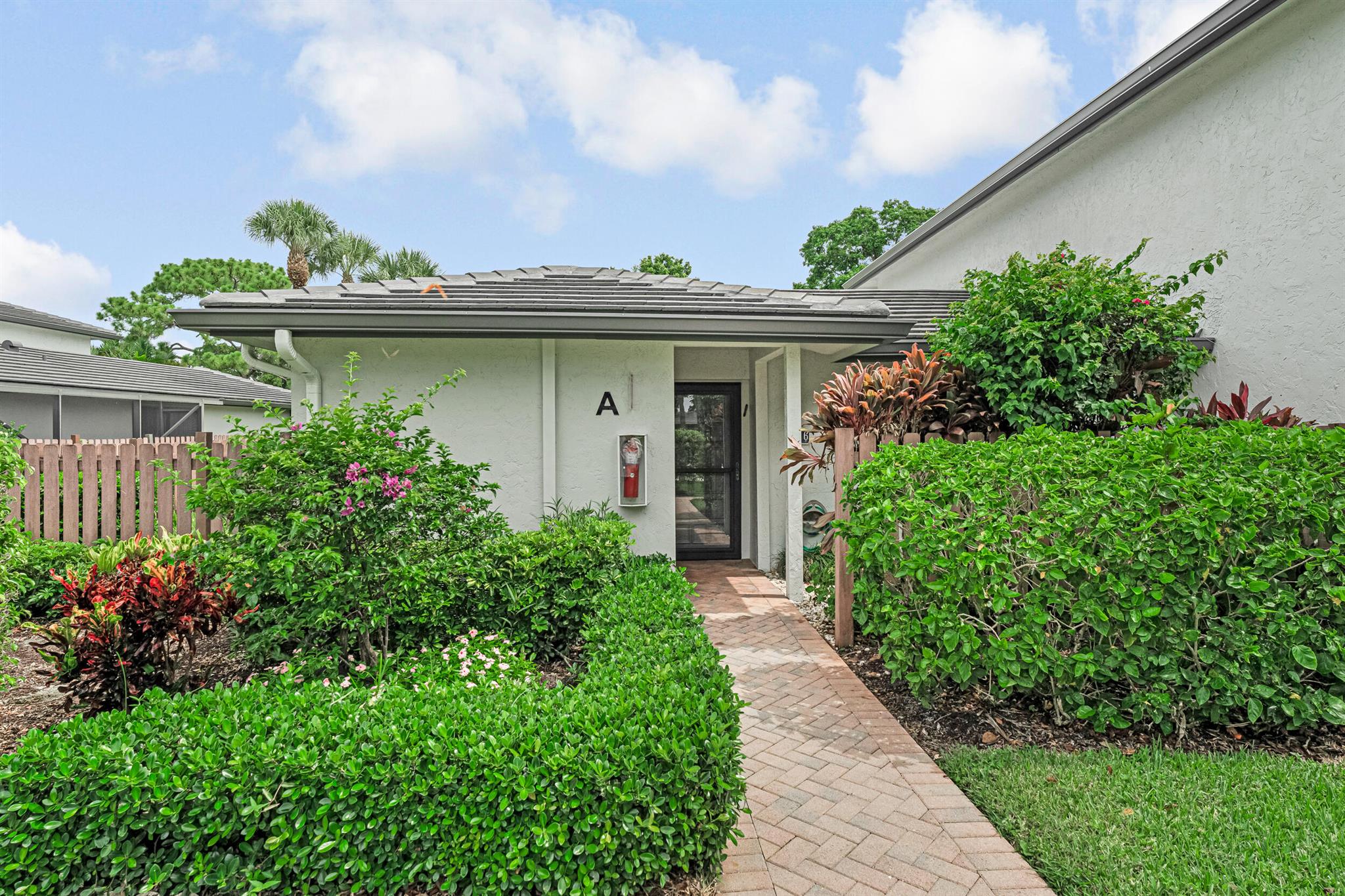 Welcome to this beautifully maintained villa in the exclusive Hunters Run Country Club, where luxury meets lifestyle. Hunters Run is a mandatory membership community. One of the few villas permitted to keep a golf cart, this residence offers unmatched convenience for enjoying the community's 3 championship golf courses. Inside, a spacious Florida room invites you to relax and soak in expansive golf course views. Bright, open living areas flow effortlessly for both quiet enjoyment and entertaining. Hunters Run offers top-tier tennis & pickleball courts, 7 unique dining venues, resort-style pools, a state-of-the-art fitness center, a full-service spa & salon, and social events. Southport pool & clubhouse has party rooms available for rent. Accessible parking directly in front of unit.