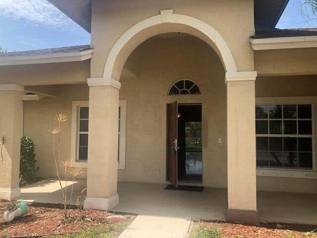 Photo of 1201 SW Idol Avenue, Port Saint Lucie, FL 34953 (MLS # B26037611)