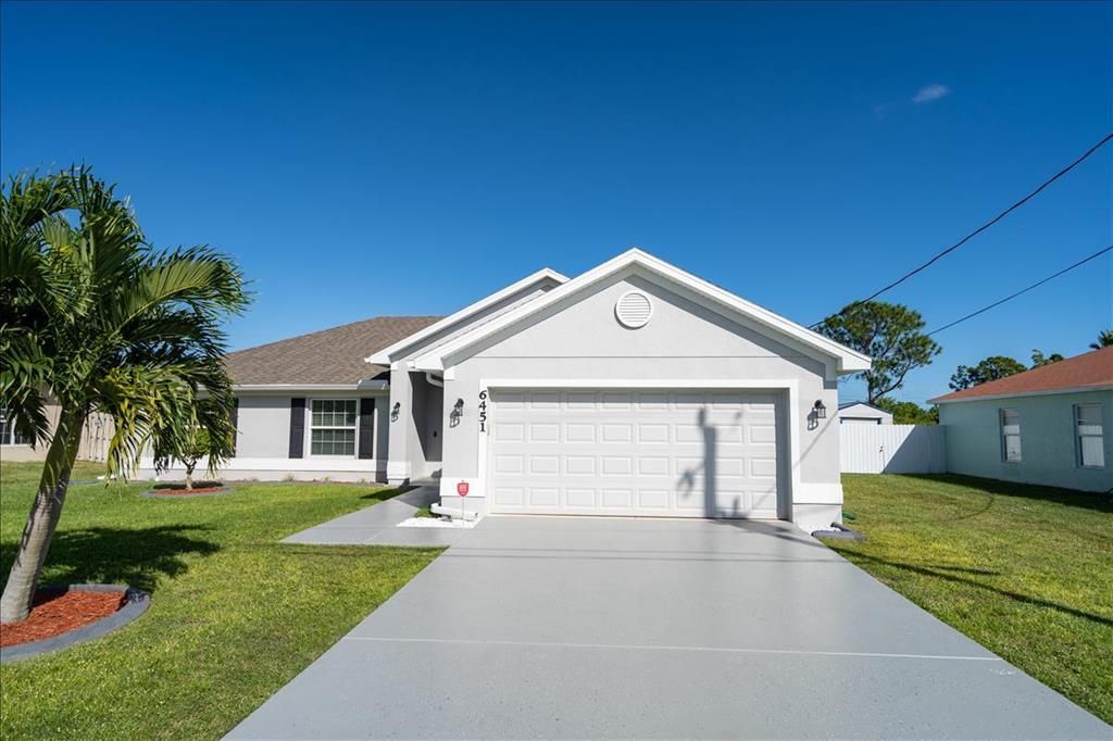 Photo of 6451 NW Volucia Drive, Port Saint Lucie, FL 34986 (MLS # R10757705)