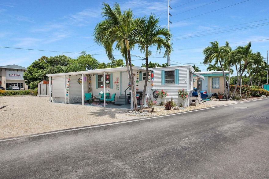 You get the home and the land at this incredible price! Enjoy the current home immediately or build a brand new stilted single-family home with the included building right that conveys with the property. This classic Keys retreat is nestled in the heart of Marathon, a prime location for those looking to indulge in all things Florida Keys. Move in ready, the newly remodeled interior of this 2-bed, 1-bath home comes furnished & features a new A/C and tankless water heater. Enjoy the convenience of a spacious enclosed laundry & storage room that can be accessed from the interior or exterior, with an addition of an outdoor storage shed as well. The property offers a low maintenance gravel lot, the 3rd largest in the community, providing ample space for parking multiple vehicles & boat trailers At Key By The Sea, residents can take advantage of the convenient & protected onsite boat ramp, community dockage & immediate ocean access.At the base of the canal sits a large clubhouse with a spacious covered outdoor entertaining space equipped with multiple seating areas, TV, ping pong tables & an indoor hall perfect for private parties and functions. At the mouth of the canal sits an oceanfront pavilion, a favorite for happy hour & BBQS. The community is pet-friendly, has additional laundry facilities & an onsite manager for added convenience. The property is walking & biking distance to grocery stores, shops, & restaurants, with the stunning Sombrero Beach just minutes away. With low association fees, a newly remodeled home & fantastic community amenities, this property offers the ideal Florida Keys lifestyle at an affordable price. Hurry, this is highly desirable, & won't last. Don't miss out on this opportunity to live the island life today.