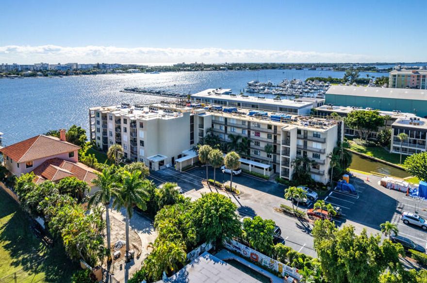 Beautifully remodeled 2/2 condo with a top floor location in this quiet, gated, waterfront community by the intracoastal. Enjoy the water views in front and back from your private balcony. This home has remodeled kitchen and baths, all hurricane impact windows, a new washer and dryer, A/C 2024, custom closets with built-ins, a storage unit and more. An added bonus is the Loggerhead Marina right next door, great for boating enthusiasts. See it today!
