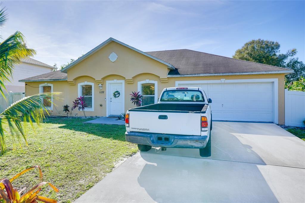 Very Beautiful house with open floor in Port Lucie. The house is located in a safe neighborhood. The property has an attached double car garage plus a huge driveway that can easily fit 4 cars. The property has a new floor and updated bathrooms and new water heater tank and new AC. The house has been freshly painted. The backyard is so big that it can fit 2 swimming pools. That backyard is the perfect area for parking boats and RVs and entertaining. The kitchen features new stainless appliances and new countertop. The fence in the backyard has been added less than 2 years ago for privacy. The house is located 50 minutes from the West Palm Beach International Airport and 30 minutes from the beach. The property is ready for occupancy. This property is a Must See. Schedule your showing today