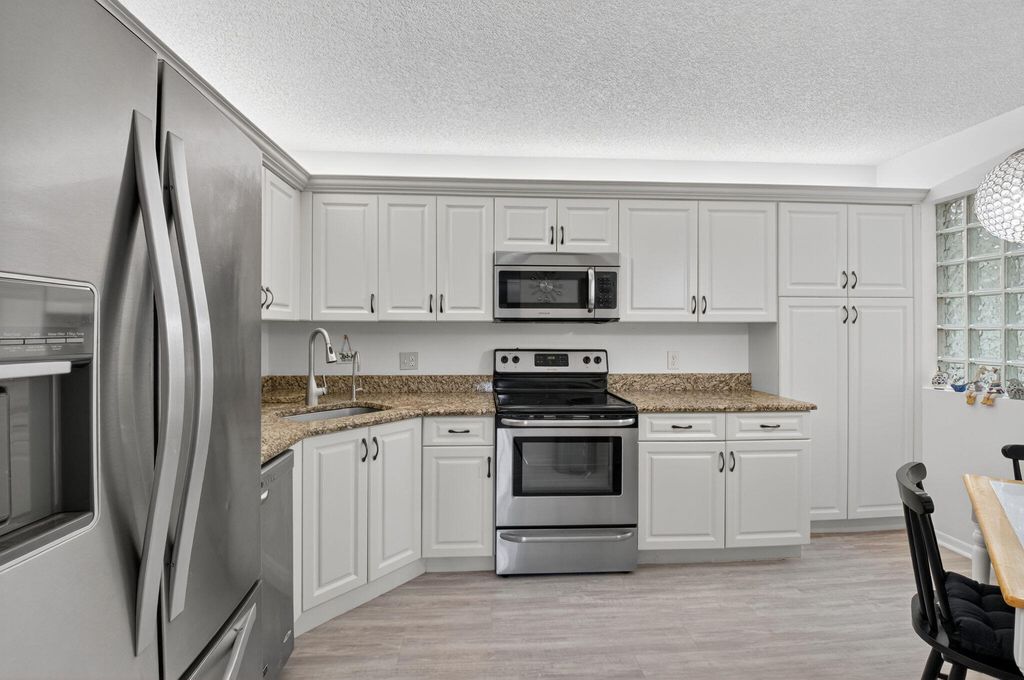 Photo of 5275 Europa Drive #H, Boynton Beach, FL 33437 (MLS # R11135213)