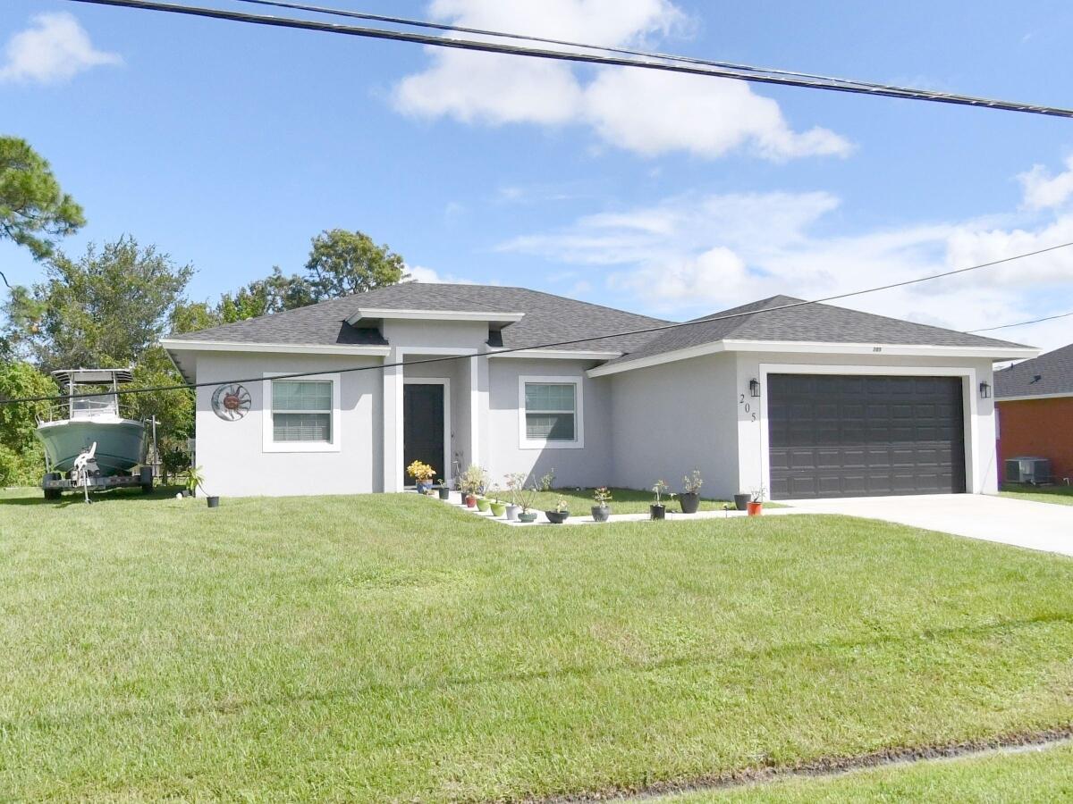 Stunning house for sale in the heart of PSL. Close to I 95 and Florida Turnpike. porcelain tile throughout, 2-car garage for vehicles and rear porch, impact windows. There are 3 bedrooms, 2 bathrooms, Flex space (4th bedroom or den/office). The kitchen has an elevated breakfast/snack bar that overlooks the great room...a fantastic place for entertaining. The owner's retreat includes a walk-in closet, as well as an end suite bathroom that includes a vanity with plenty of counter space and his and her sinks, a frame less shower, impact windows throughout, all lights features are included, new fence, irrigation system, and more. This is a Must see!!! Sellers are motivated.