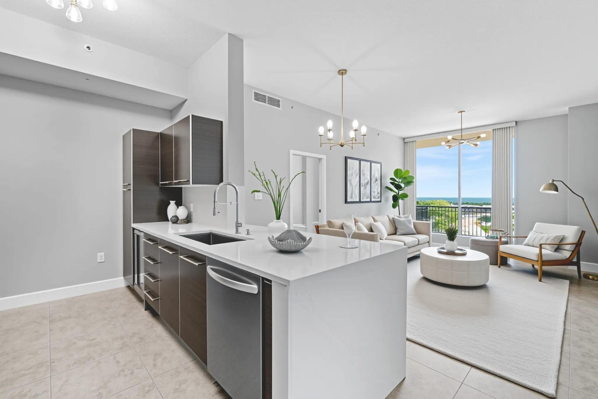 Just completed--an extraordinary kitchen renovation featuring brand-new white quartz waterfall countertops, a deep stainless steel sink, and a sleek new stovetop. This southeast-facing penthouse boasts panoramic ocean views from every room, perched above the resort-style pool deck. Soaring 10FT ceilings and floor-to-ceiling hurricane-impact windows flood the space with natural light, showcasing breathtaking vistas of the Ocean and Intracoastal waterways. Located in the heart of booming Downtown West Palm Beach, you're steps from top dining, shopping, The Kravis Center, the Brightline, & all the cultural events the city has to offer. Downtown West Palm Beach is in the midst of a major transformation, quickly becoming one of South Florida's most sought-after destinations for luxury living,