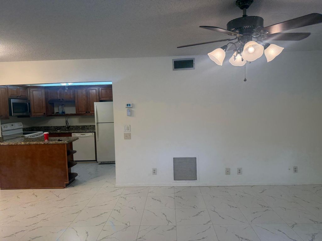 Photo of 211 Pine Hov Circle #D-2, Greenacres, FL 33463 (MLS # B26005181)