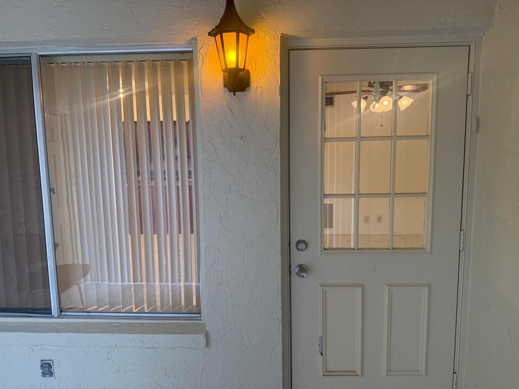Photo of 211 Pine Hov Circle #D-2, Greenacres, FL 33463 (MLS # B26005181)