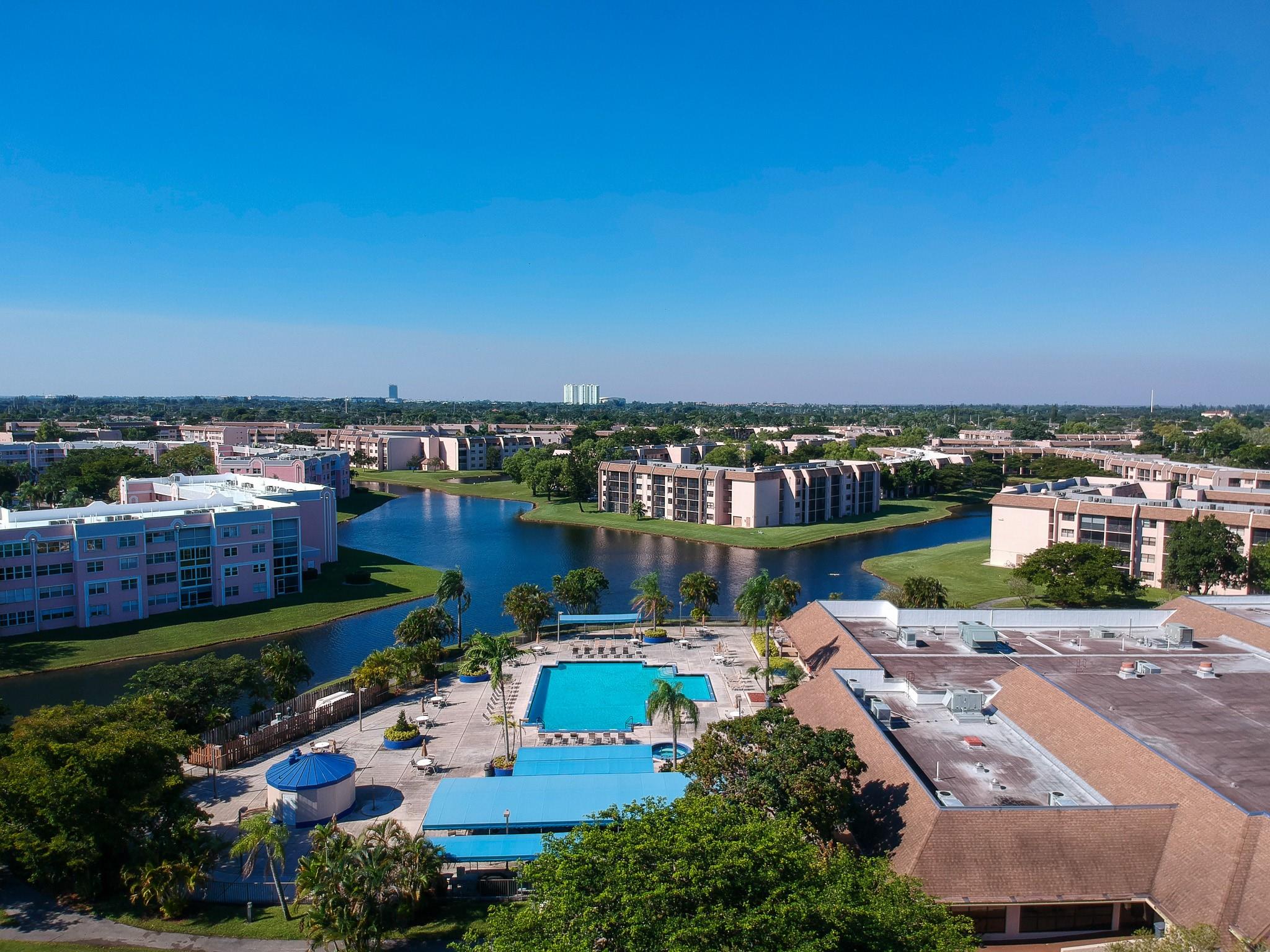 MOTIVATED SELLER!!! Welcome to Sunrise Lakes Phase 4! This charming 2-bedroom, 2-bath unit has been professionally appraised at $120,000 and offers peaceful lake views right from your private balcony — perfect for enjoying a morning cafecito or an evening glass of wine. The unit includes its own washer & dryer and is just steps away from a wide range of resort-style amenities! The main clubhouse features a theater, fitness center, ballroom, billiards & ping pong rooms, and a sparkling swimming pool. Centrally located between Sawgrass Mills Mall and Broward Mall, you’ll be just minutes from top dining, shopping, and major highways including Sawgrass Expressway, I-75, 595, Sunrise Blvd, and Oakland Park Blvd. This is Florida 55+ living at its best — don’t miss your chance to experience it!