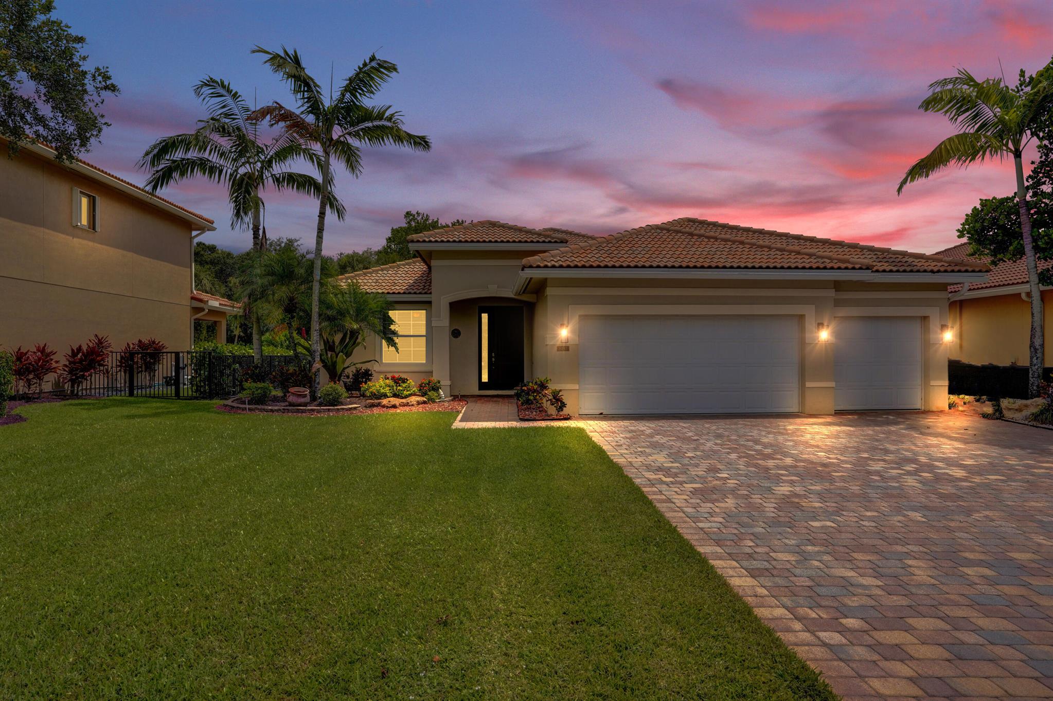 Stunning turnkey 4BR/3BA single-story home in Lyons Ranches. Located on a quiet cul-de-sac with no rear neighbors, this 3-car garage home features lush tropical landscaping and a spacious brick-paver driveway, offering exceptional curb appeal. Inside, you'll find an open-concept split floor plan with porcelain tile flooring, impact windows, and abundant natural light. The home is equipped with a 2011 roof, 2017 A/C, and an alarm system with security cameras offering both comfort and peace of mind. The kitchen is warm and inviting, featuring granite countertops, newer stainless steel appliances, ample cabinetry, a double oven, and soft recessed lighting. It opens to a cozy family room, an elegant dining area with a stylish chandelier, anda light-filled living room with peaceful views