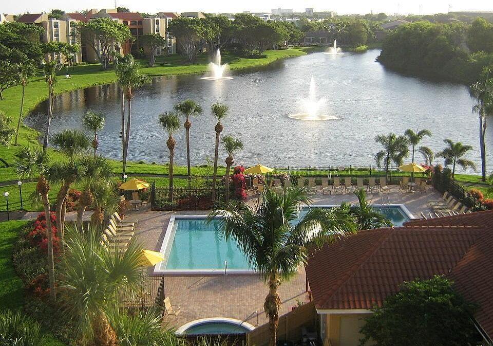 Turnkey & Fully Furnished Condo with Lake View in Lakeside CondominiumsStep into this renovated 2-bedroom, 2-bathroom split-floorplan unit offering breathtaking lake views. This move-in ready home features high-end appliances, elegant laminate wood flooring, ample closet and storage space, and an in-unit laundry room. Enjoy serene mornings on your private veranda overlooking the tranquil lake.Lakeside Condominiums offers resort-style amenities including a heated pool, spa, and a fully equipped fitness center--all within a beautifully maintained clubhouse.