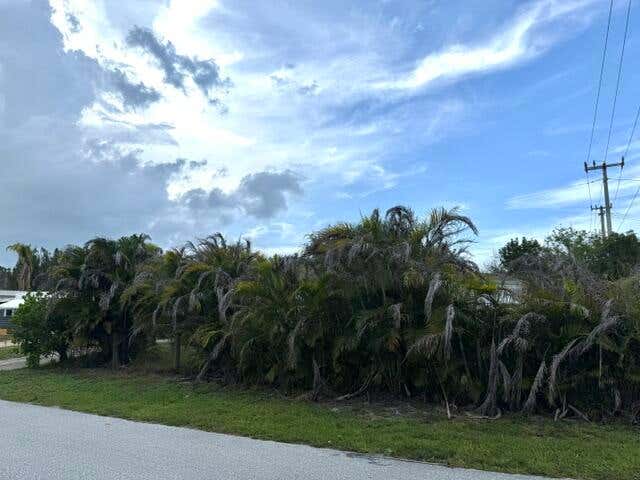 Photo of 8423 SE Sandy Lane, Hobe Sound, FL 33455 (MLS # B26054415)